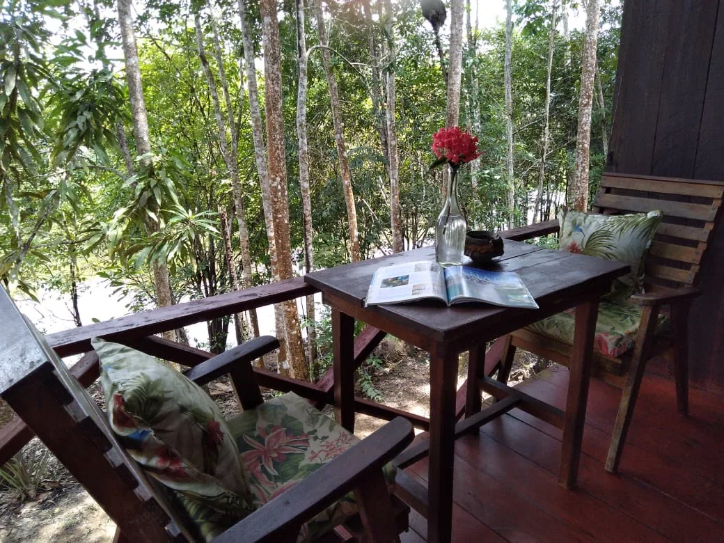 Veranda of a standard lodge bungalow over the forest