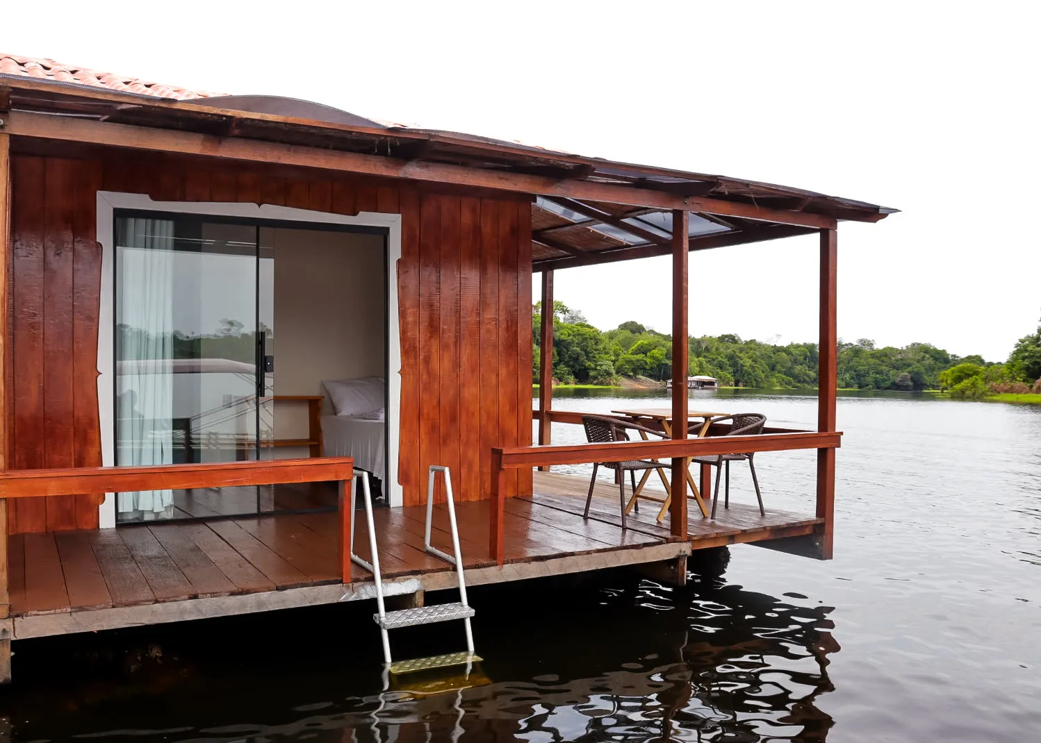 Deck of a floating bungalow at the water’s edge