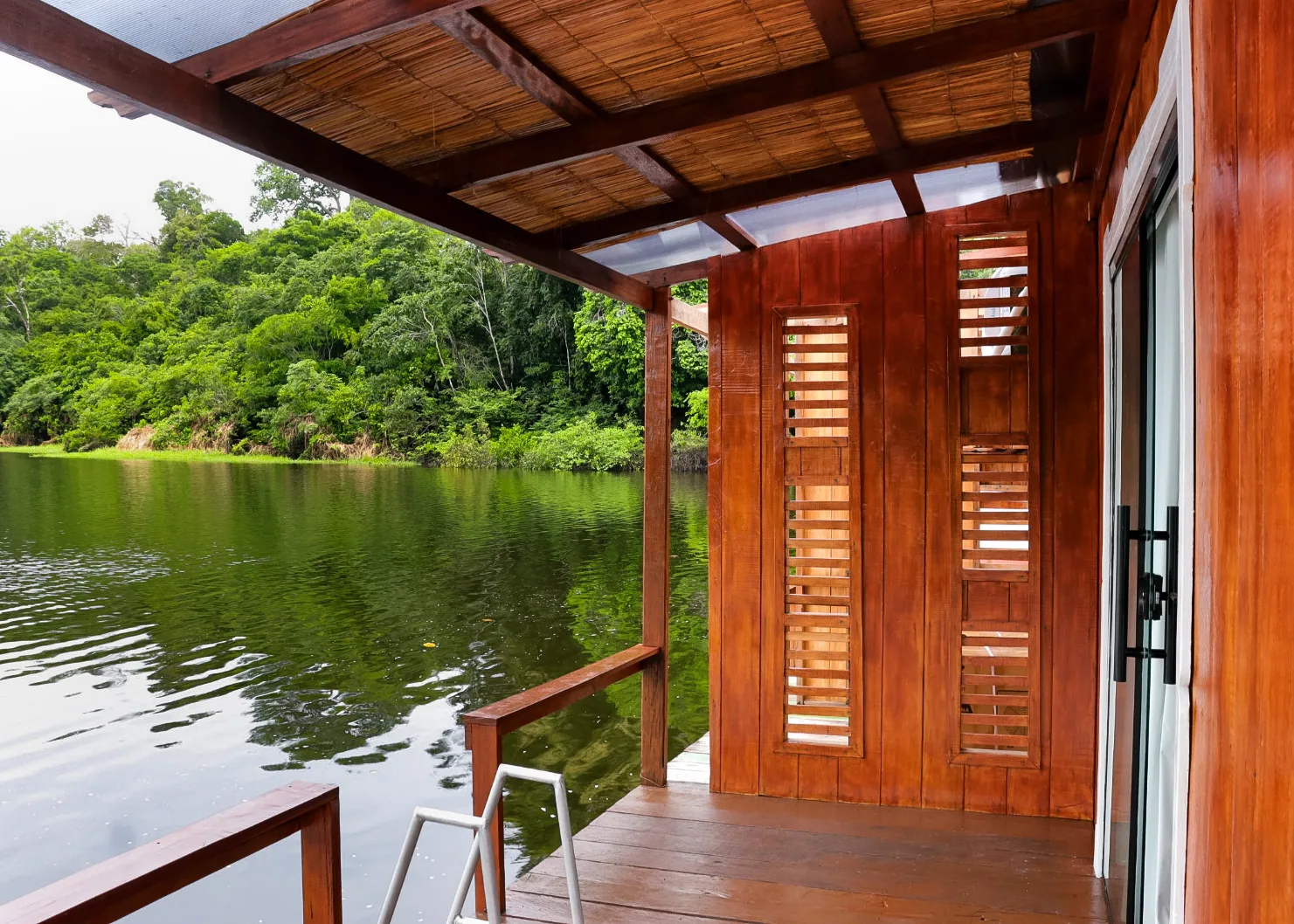 Private deck over the river outside a floating cabin