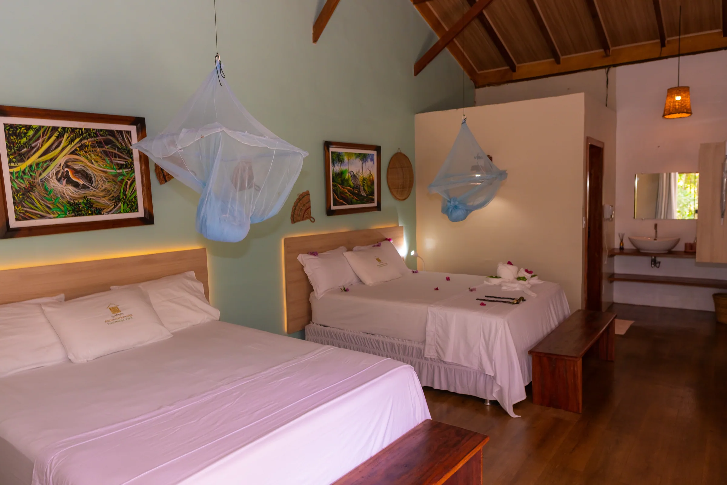 Double bed under a mosquito net in a premium suite