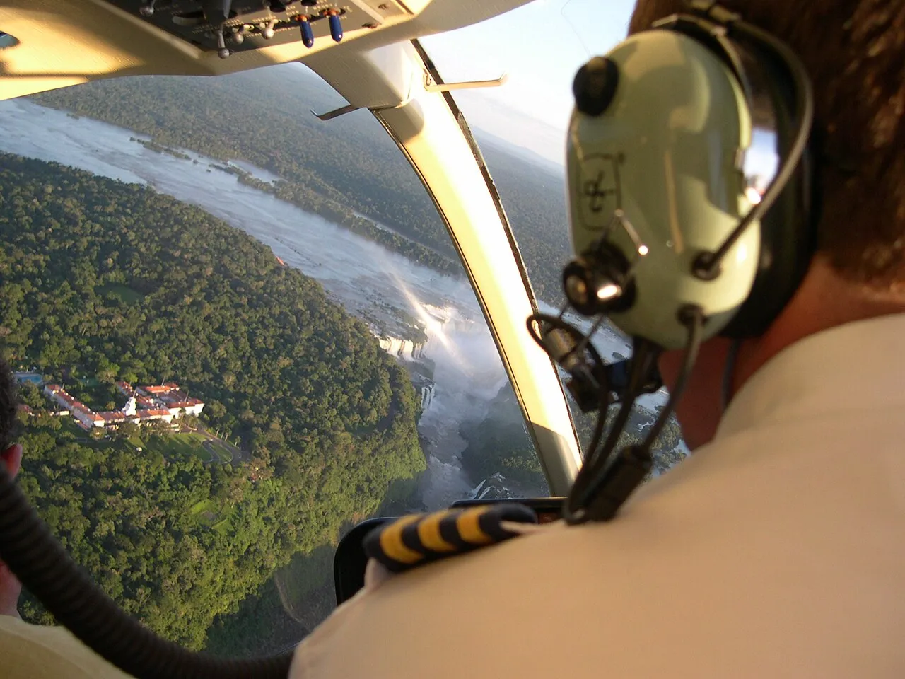 Aerial view of the Iguaçu Falls stretching across the forested gorge