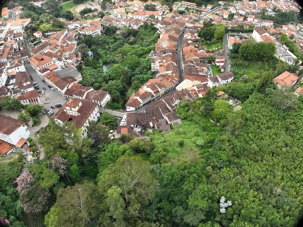 Steep cobbled street with colourful colonial houses in Ouro Preto