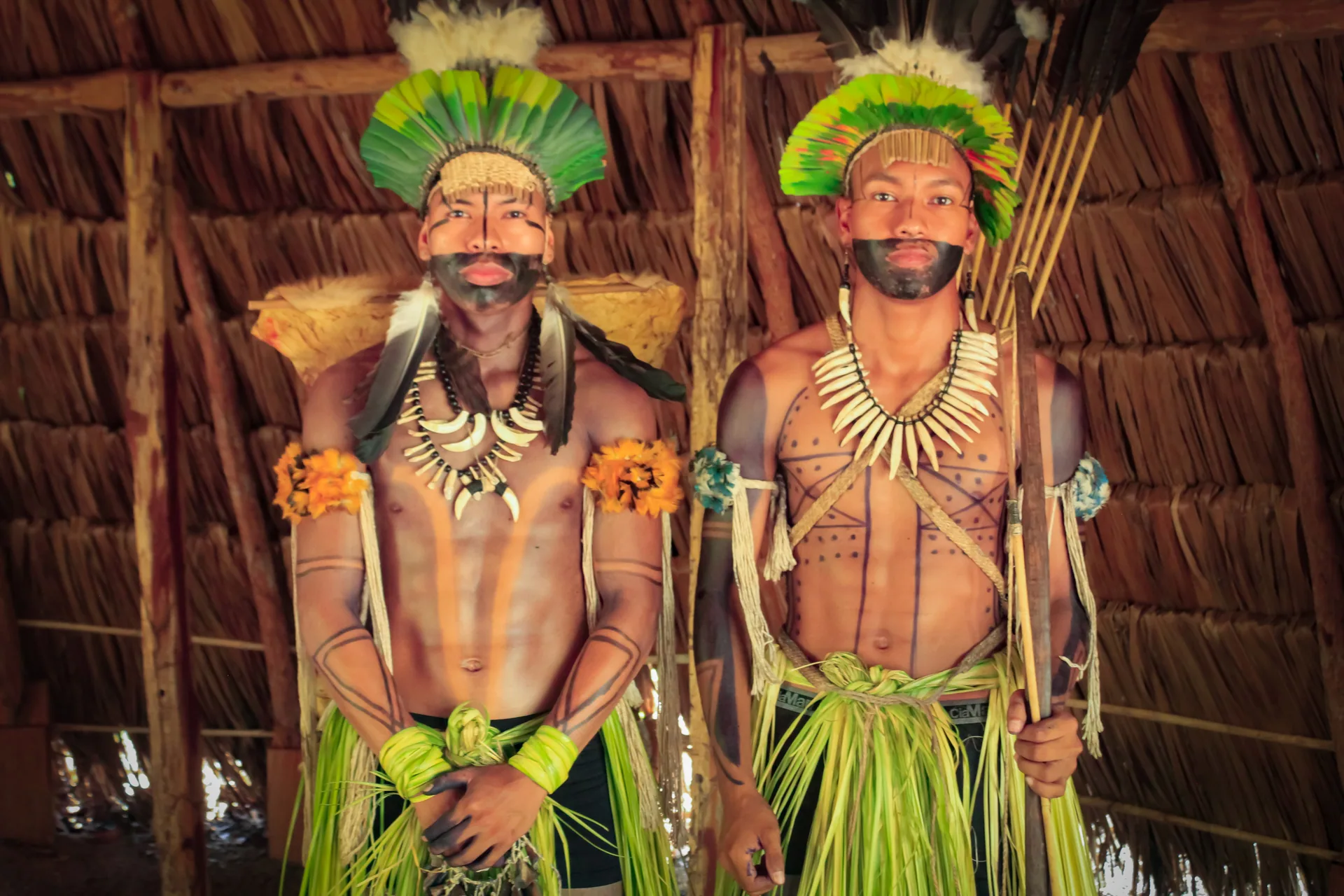 Two Balatiponé Umutina community members in ceremonial clothing in their reserve