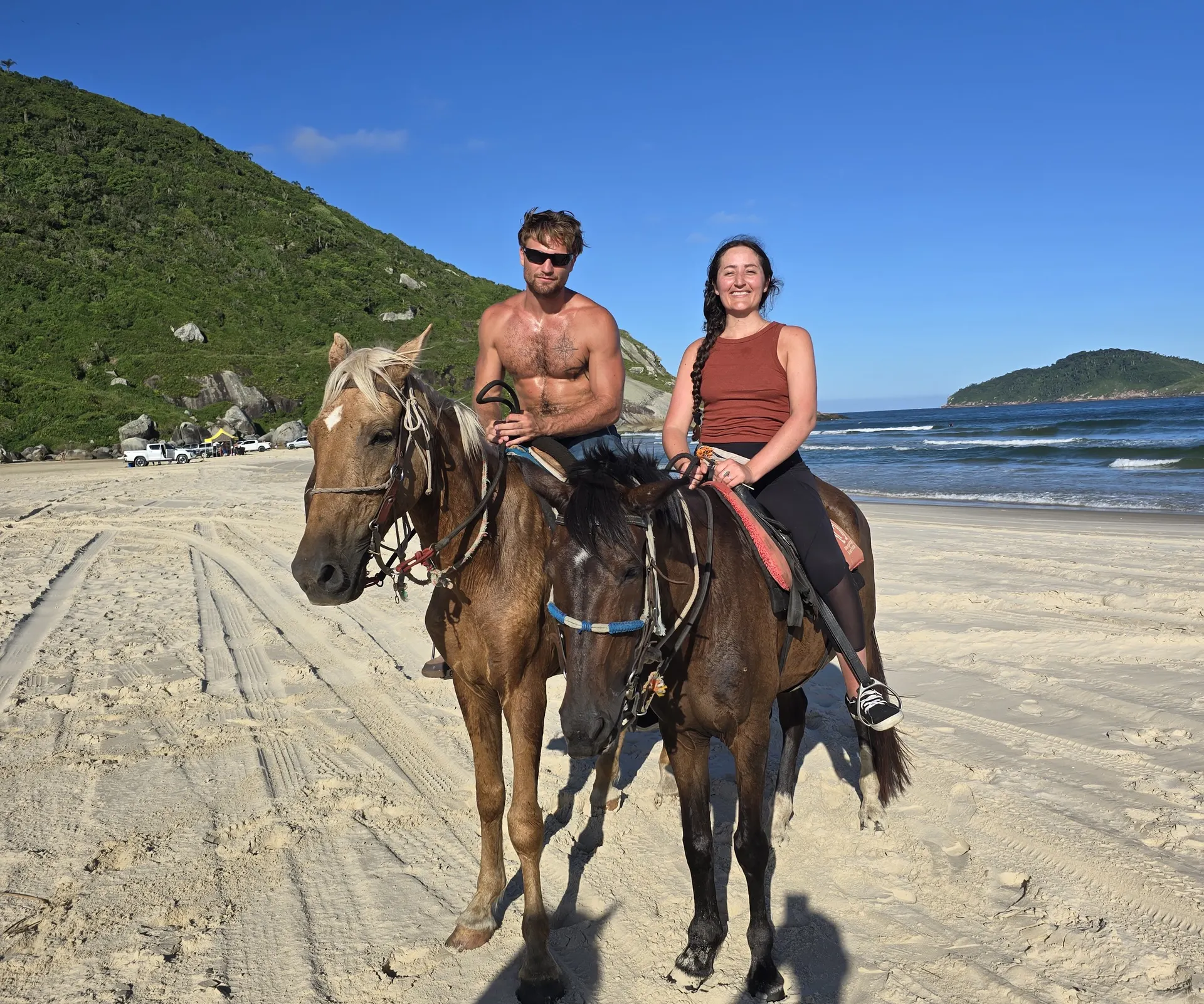 Horseback riding along the water’s edge on the long, empty sand of Praia do Mocambique