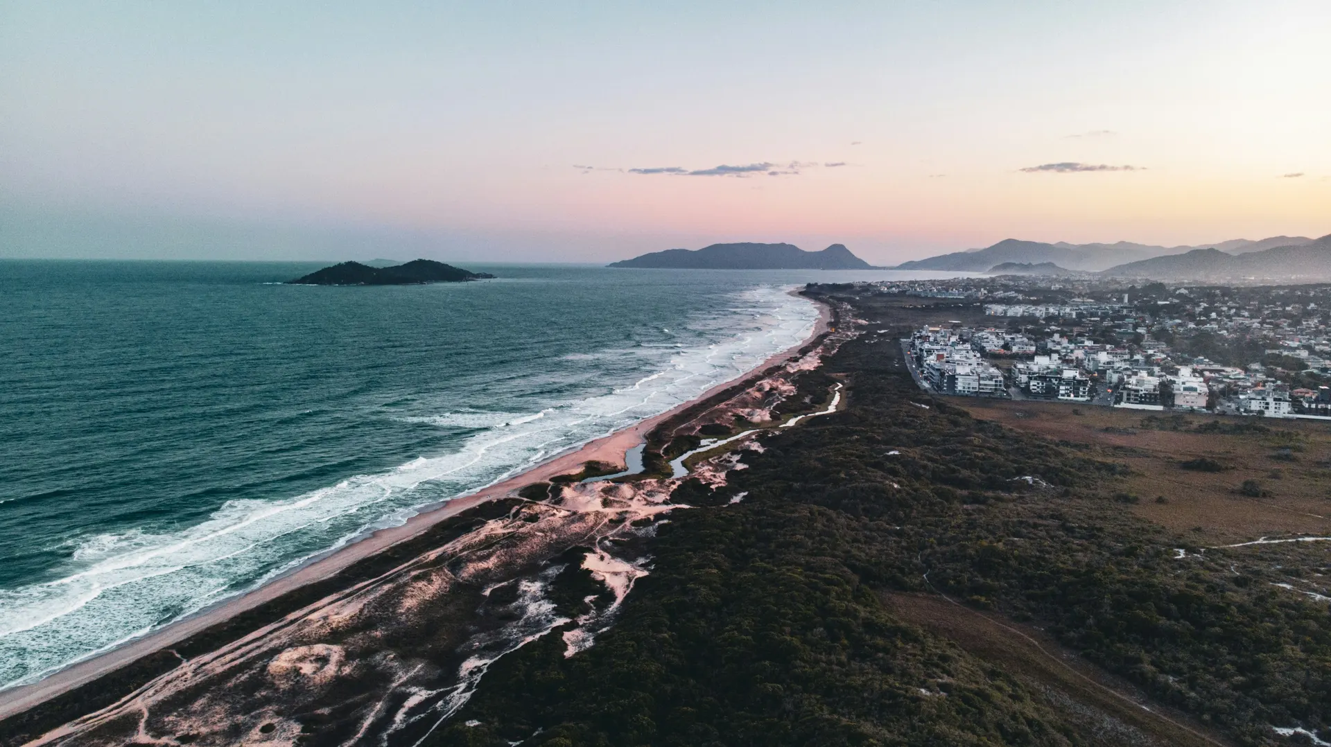 A wild, forest-backed surf beach in the undeveloped south of the island