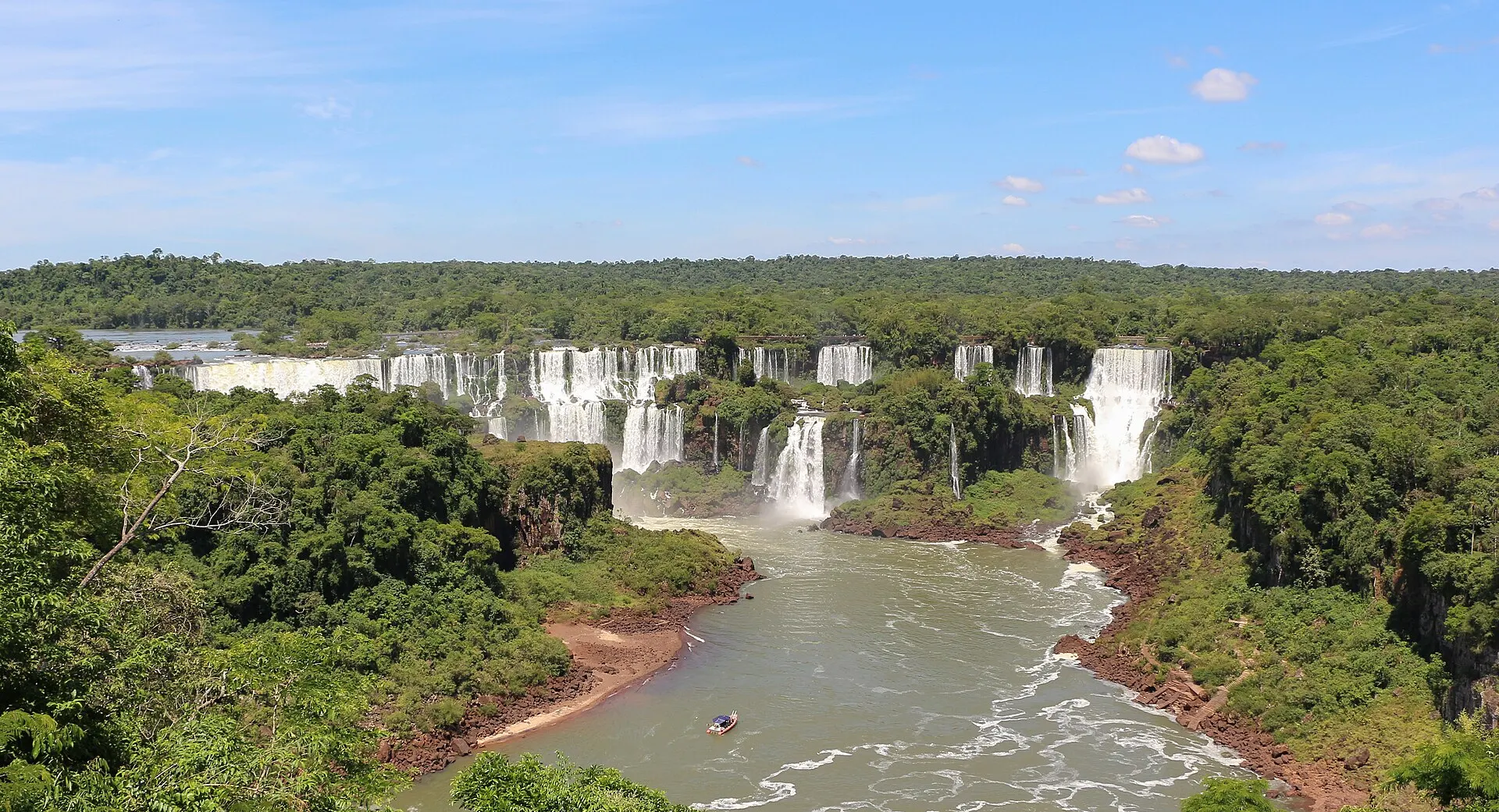 Panoramic view of the Iguaçu Falls cascading through rainforest