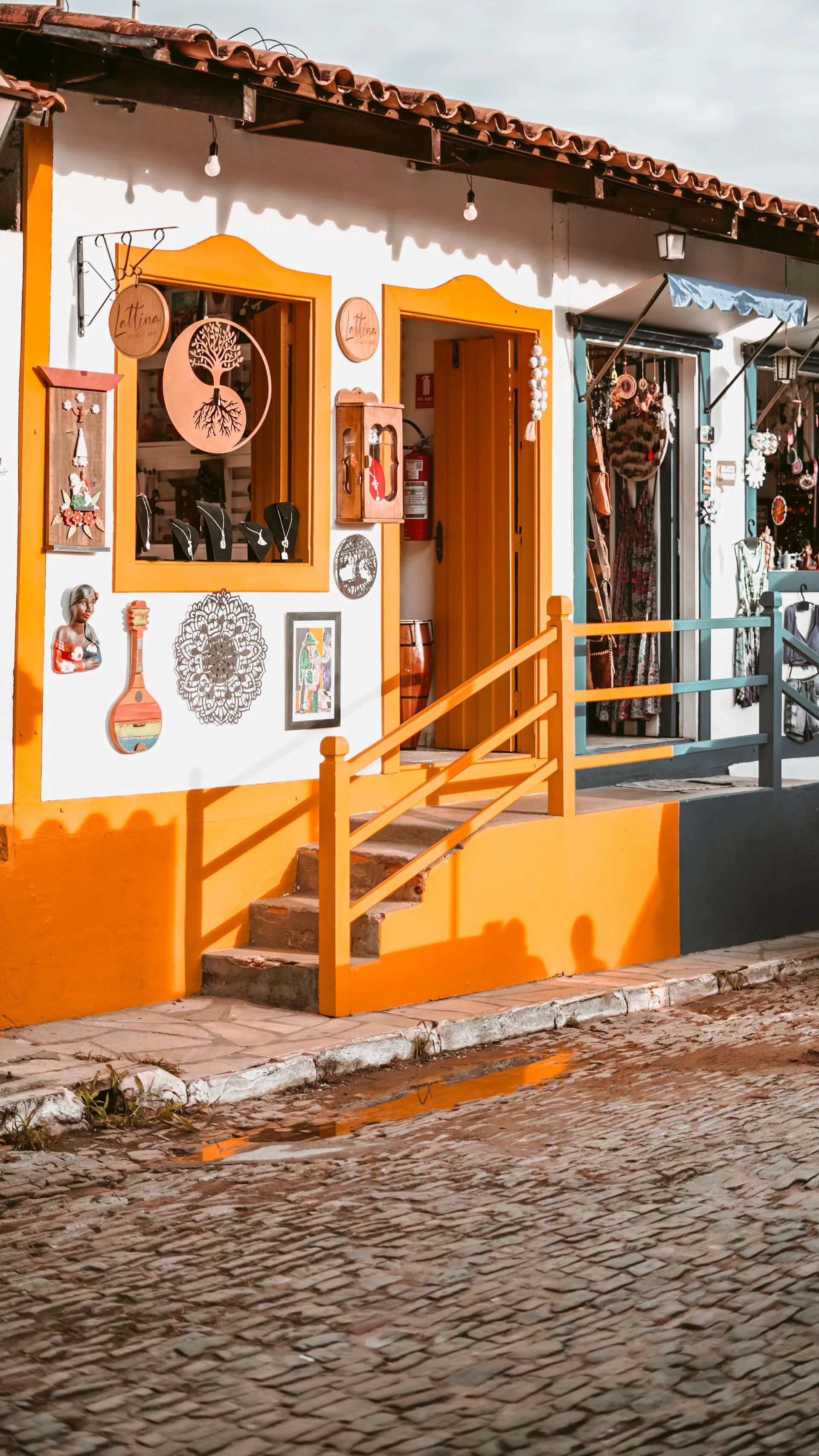Colourful handicraft stalls in the cobbled centre of Embu das Artes