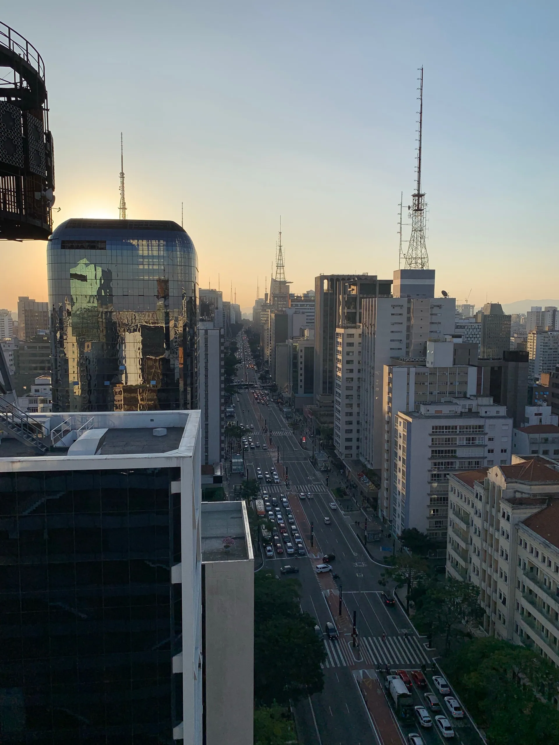 A golden-hour view down Avenida Paulista from a rooftop, São Paulo